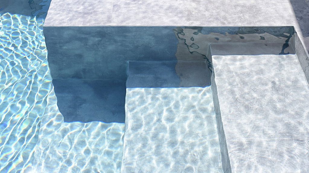 Detalle de la membrana armada URBAN, destacando su textura que simula el cemento pulido industrial.